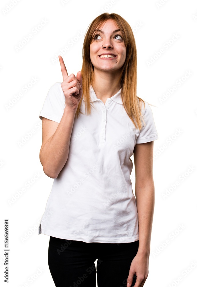 Beautiful young girl pointing up Beautiful young girl pointing up