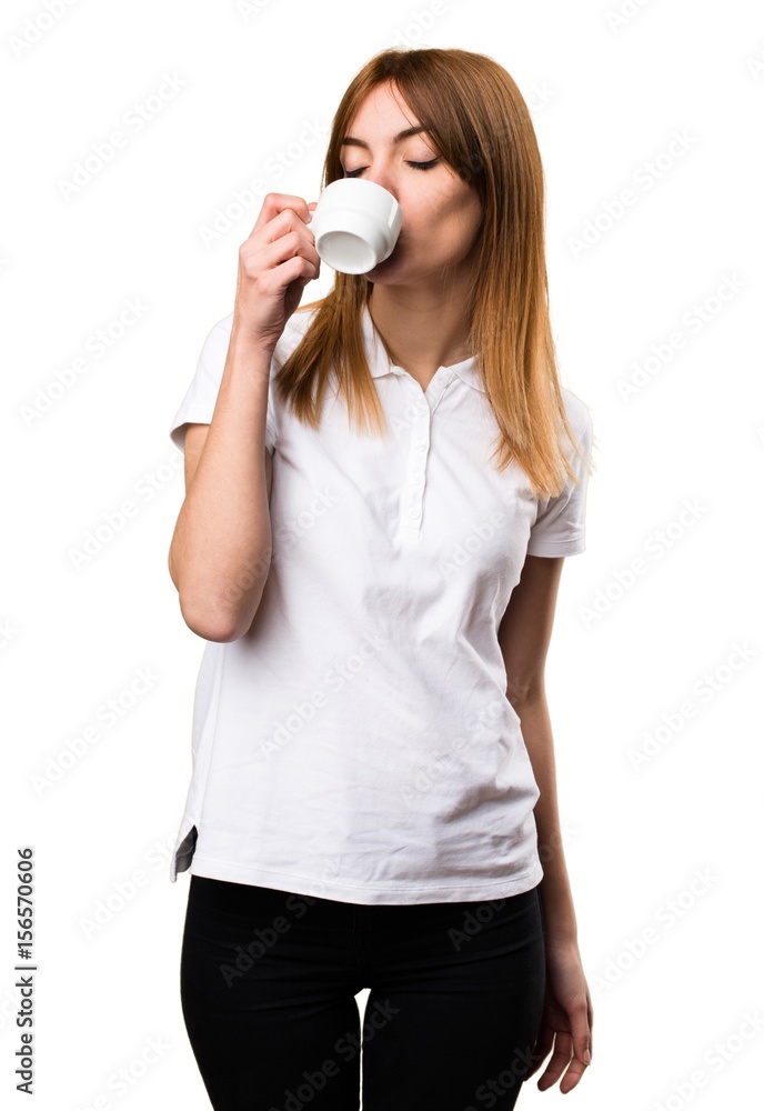 Beautiful young girl holding a cup of coffee Beautiful young girl holding a cup of coffee