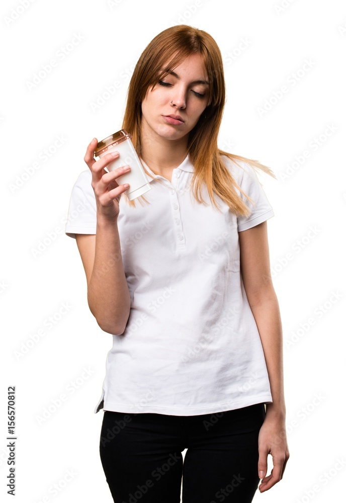 Obraz premium Beautiful young girl holding a cup of coffee