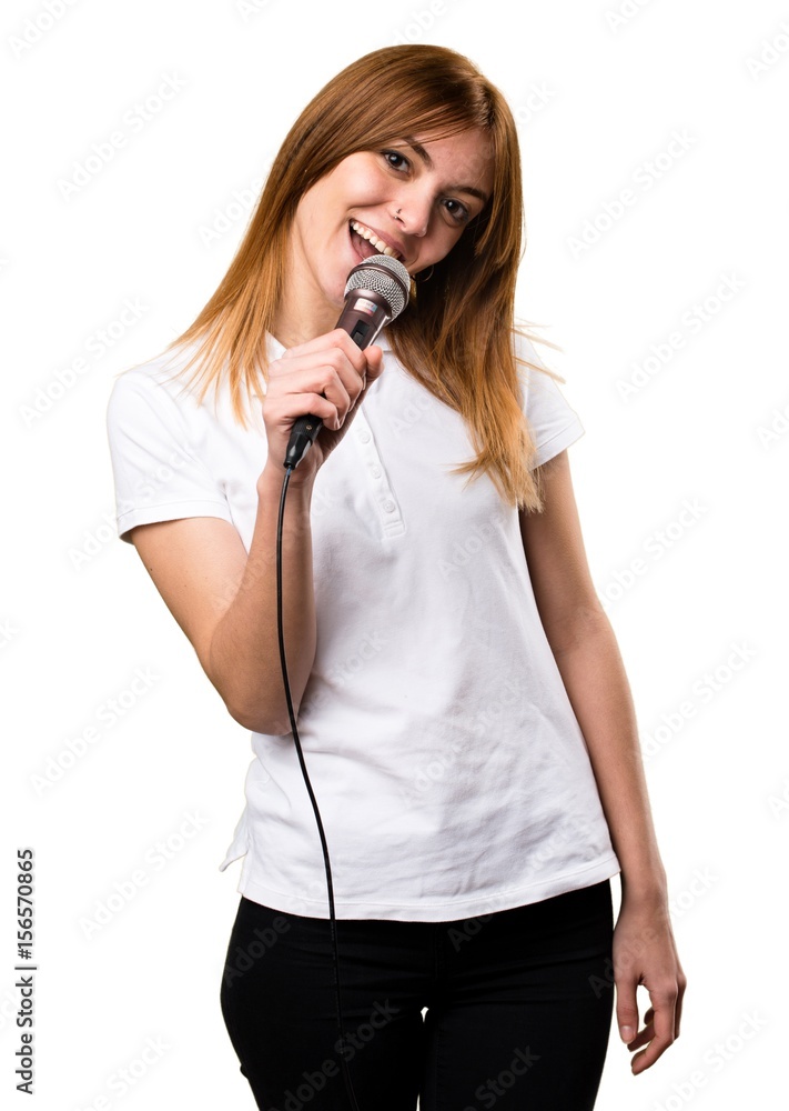 Happy Beautiful young girl singing with microphone Happy Beautiful young girl singing with microphone