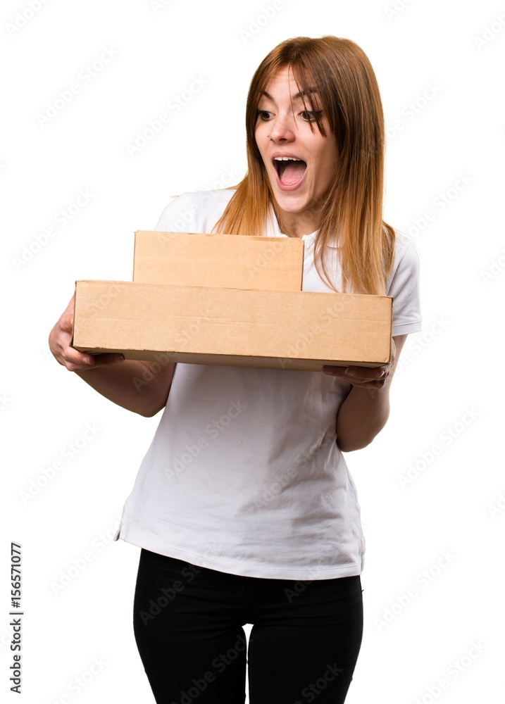 Surprised Beautiful young girl holding boxes Surprised Beautiful young girl holding boxes