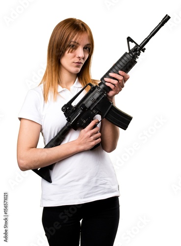 Beautiful young girl holding a rifle