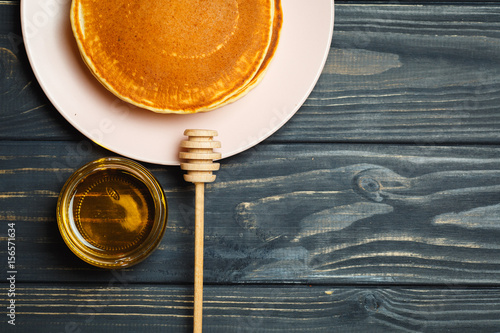 sweet Pancakes with honey in a jar
