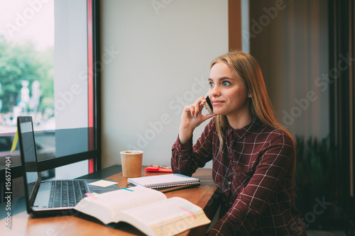 The student learns hard lessons or homework. Woman preparing for exams. Session at universities and institutes The fast food on the go. A girl preparing for exams. © estradaanton