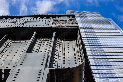 Minimal view of a bridge and office building side by side New York City