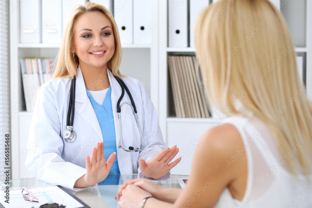 Doctor reassuring her female patient. Medicine, help and health care concept Doctor reassuring her female patient. Medicine, help and health care concept