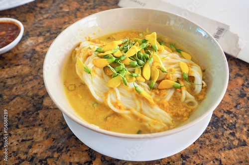 A Bowl of Num Banh Chok, or Traditional Cambodian Rice Noodles Topped with Herbs