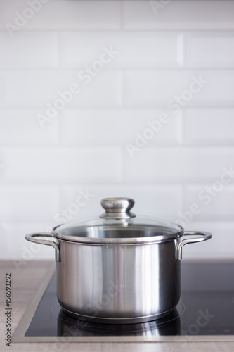 close up of metal pot on electric stove in kitchen