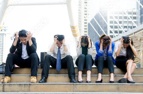 Canvas Print Group of asian business people worried and concerned at walk way area in the city