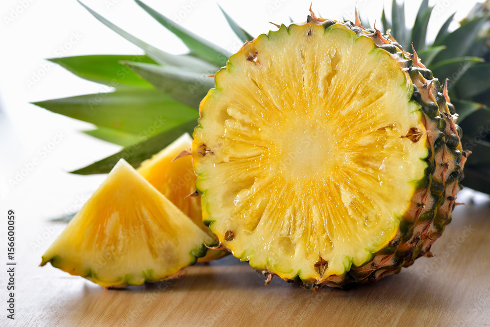 pineapple sliced on wood background pineapple sliced on wood background