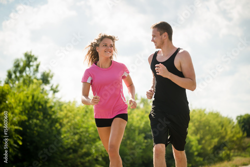 Young couple running together. Fitness concept.