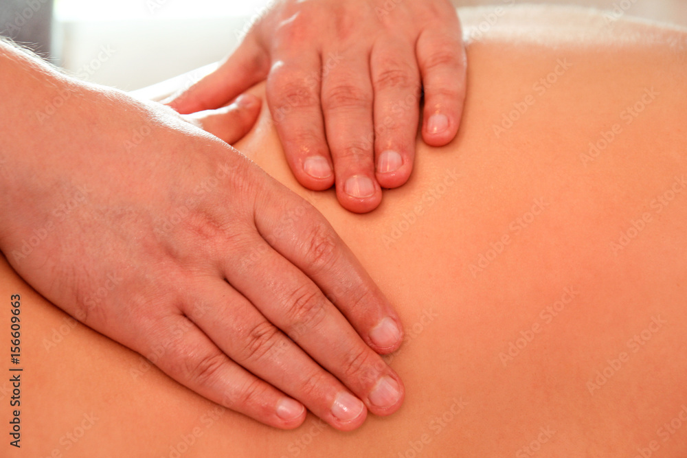 Massage relax studio. Spa treatment. Close up detail of hands massaging female shoulder and back. Masseuse hands massaging female back. Beautiful young woman getting back massage at spa. Body care. Massage relax studio. Spa treatment. Close up detail of hands massaging female shoulder and back. Masseuse hands massaging female back. Beautiful young woman getting back massage at spa. Body care.
