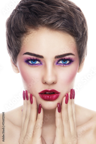 Portrait of young beautiful woman with stylish make-up and long nails
