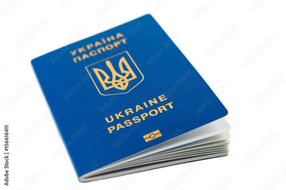 New ukrainian blue international biometric passport with identification chip and fingerprints isolated on white. Selective focus New ukrainian blue international biometric passport with identification chip and fingerprints isolated on white. Selective focus