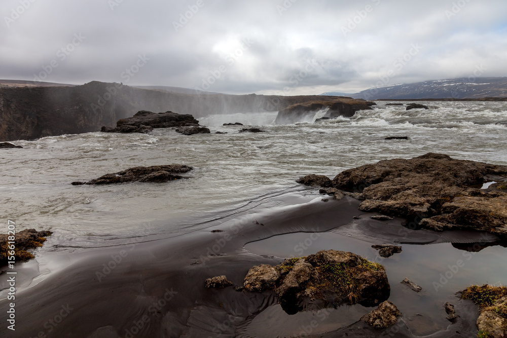 Water of the Godafoss Waterfall - beautiful part of stony rocky desert landscape of Iceland