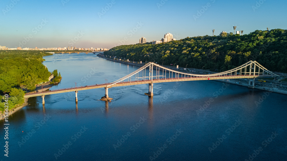 Aerial top view of pedestrian Park bridge and Dnieper river from above, city of Kiev, Ukraine
