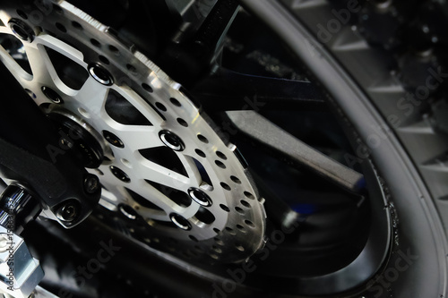 The front wheel of a motorcycle. Close up brakes and spokes © NVB Stocker