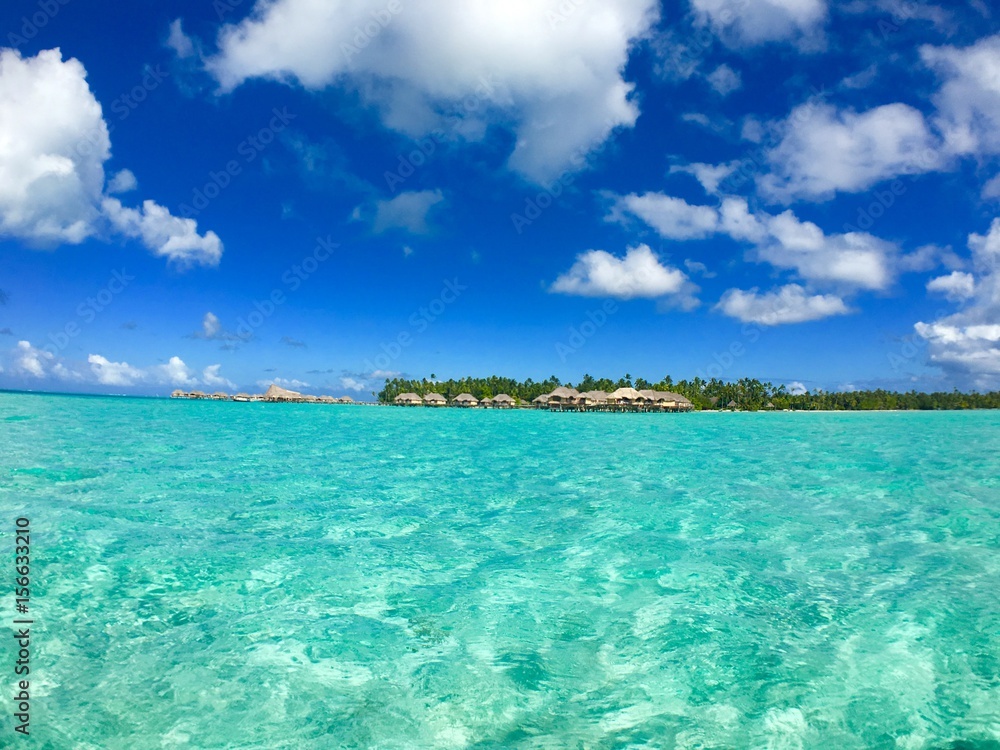 Overwater bungalows of a luxury resort at Tahaa, Tahiti, French Polynesia