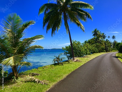 Street along the coast and lagoon of Tahaa, Tahiti, French Polynesia