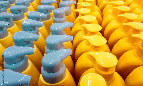 Color plastic bottles with lids in a row.