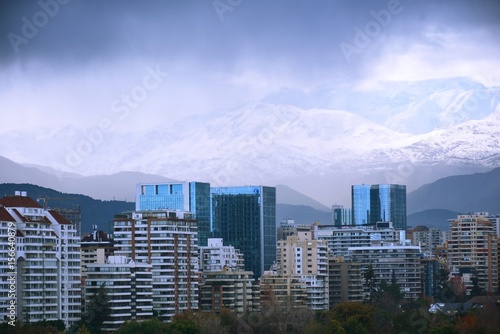 City view and snow falls in Santiago, Chile