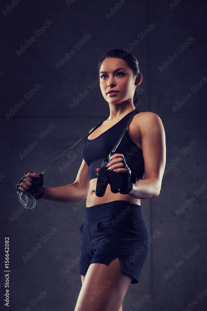 young sporty woman with jumping rope
