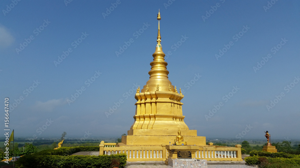 Fototapeta premium Golden Pagoda is a beautiful with blue sky background.