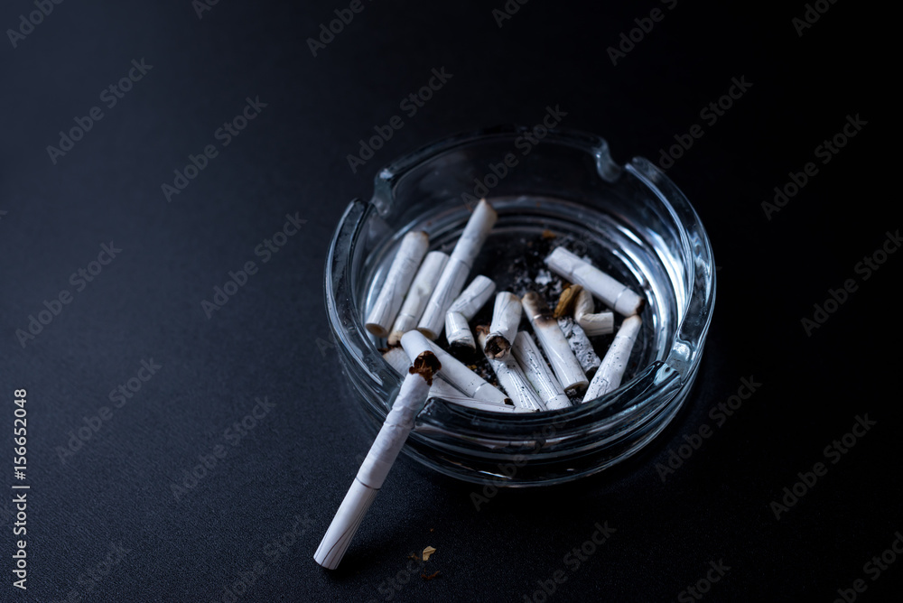 Cigarettes closeup on a black background. Stop quit Smoking background ...