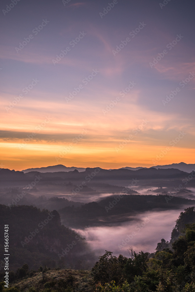 Morning twilight sky and mountain with fog