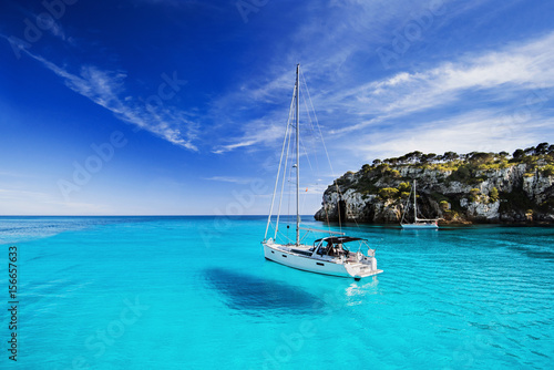 Fototapeta Naklejka Na Ścianę i Meble -  Beautiful bay with sailing boats, Menorca island, Spain