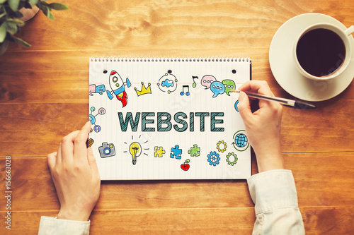 Website text with a person holding a pen