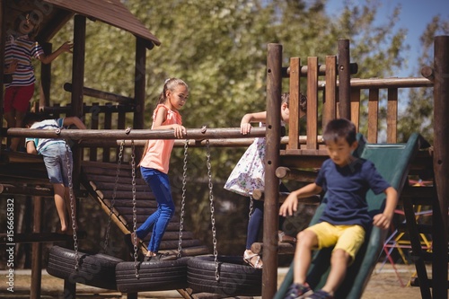 schoolkids playing in playground photo