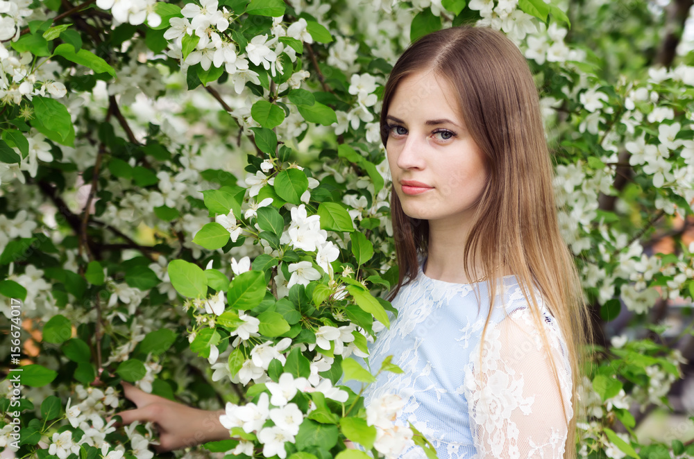 Girl posing against a background of flowering trees / Photographed in Russia, in the city of Orenburg Girl posing against a background of flowering trees / Photographed in Russia, in the city of Orenburg