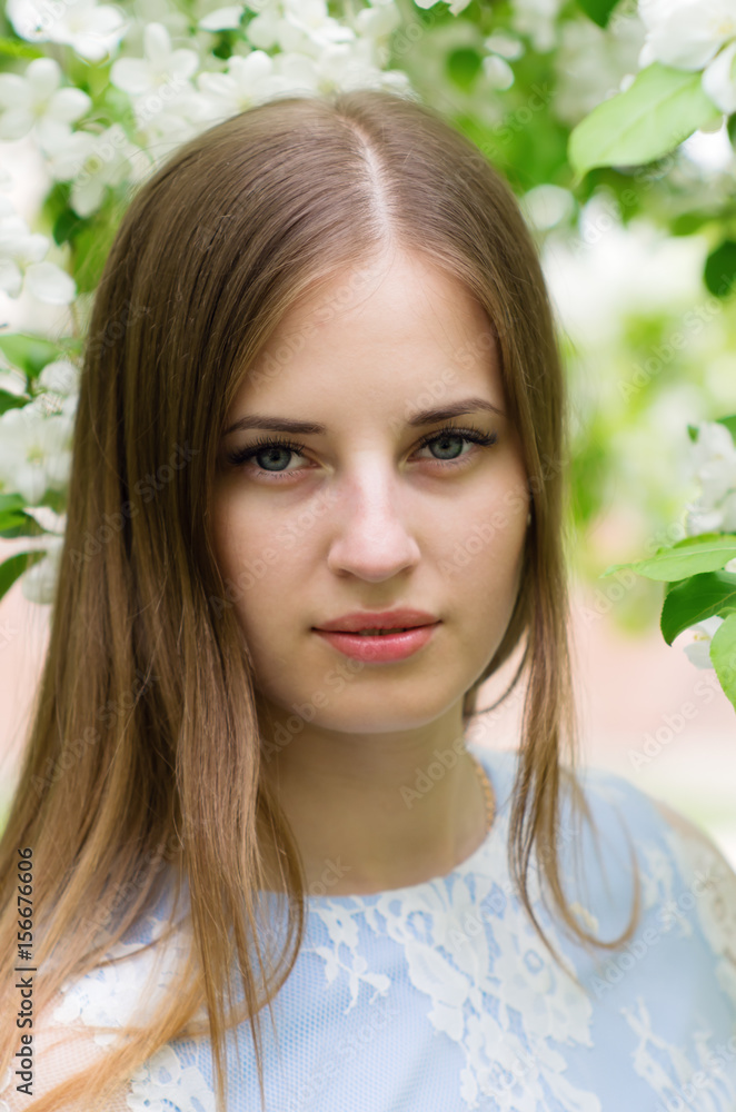 Girl posing against a background of flowering trees / Photographed in Russia, in the city of Orenburg Girl posing against a background of flowering trees / Photographed in Russia, in the city of Orenburg