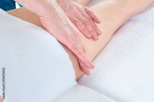 Therapist makes anti-cellulite massage young woman at medical clinic