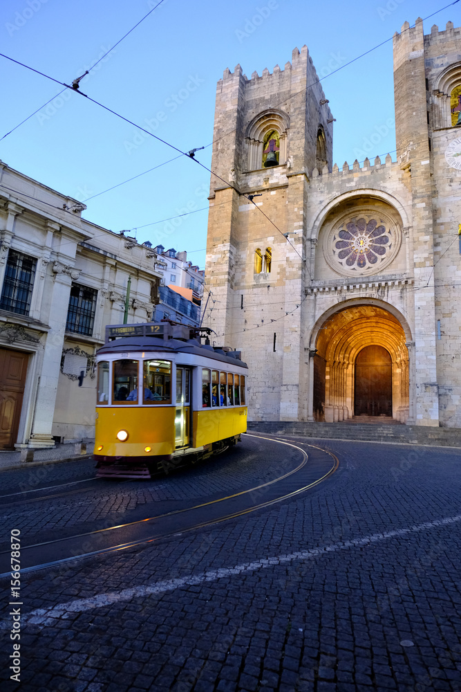 Fototapeta premium Traditional yellow tram at old streets