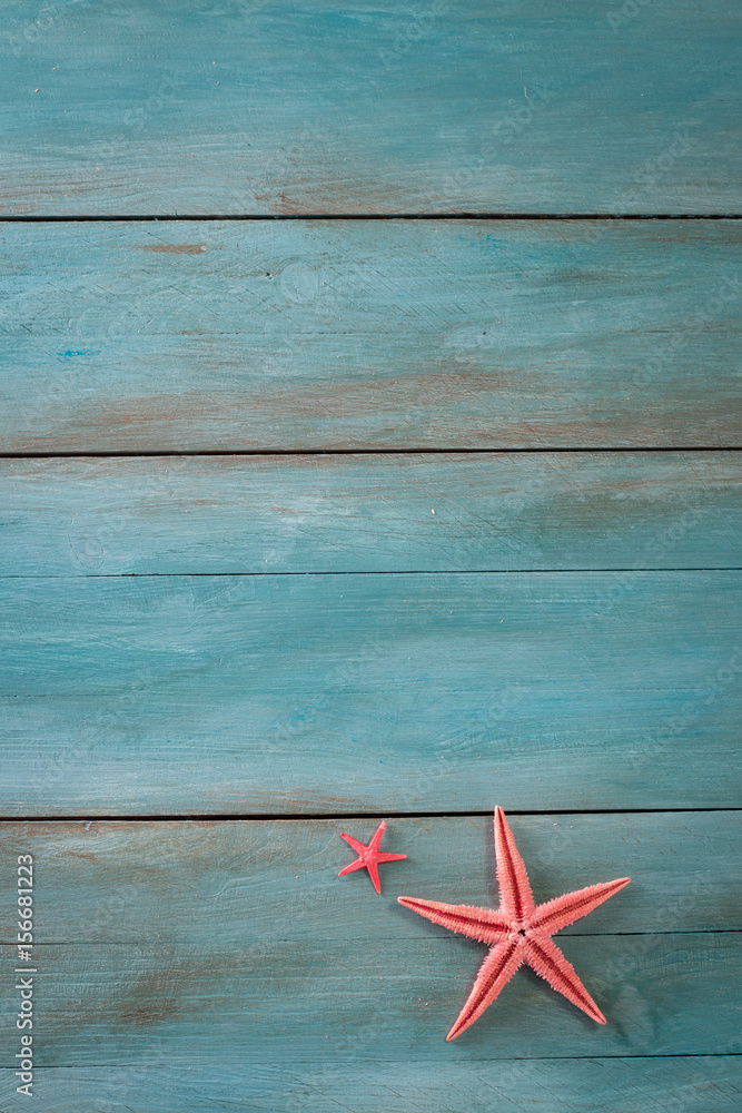 Summer time sea vacation background with star fish, marine rope on dark blue background Summer time sea vacation background with star fish, marine rope on dark blue background