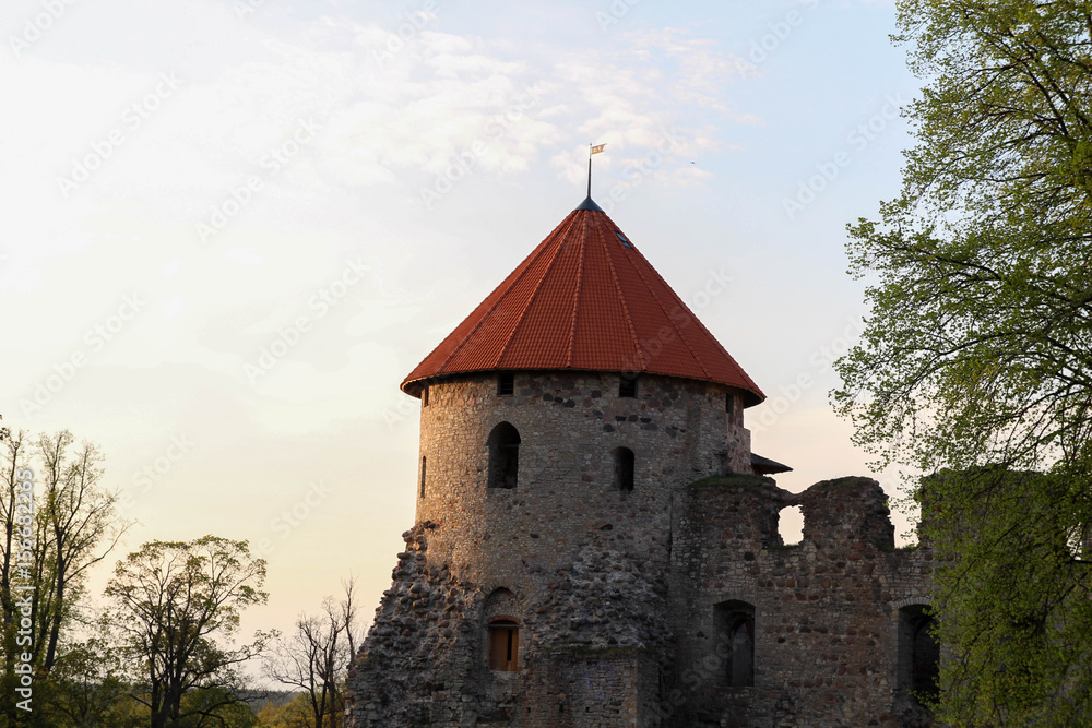 View of beautiful ruins of ancient Livonian castle in old town of Cesis, Latvia. Today Cesis is an important cultural and artistic centre. View of beautiful ruins of ancient Livonian castle in old town of Cesis, Latvia. Today Cesis is an important cultural and artistic centre.
