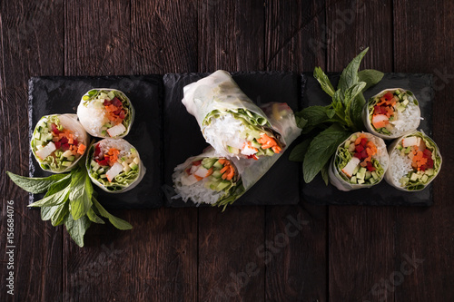Delicious vietnamese spring roll with vegetable on dark background ,healthy food photo