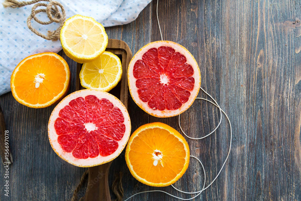Citrus fruits on rustic wooden table. Copy space. Citrus fruits on rustic wooden table. Copy space.