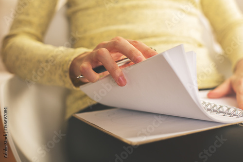 Woman going through notes