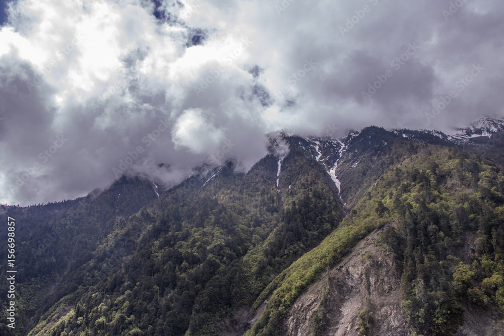 Mountain surrounded by cloud at dawn landscape in Shangri La, Yunnan Province, China Mountain surrounded by cloud at dawn landscape in Shangri La, Yunnan Province, China