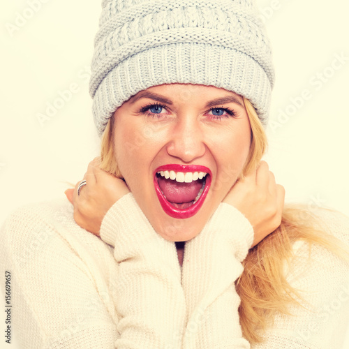 Happy young woman in winter clothes