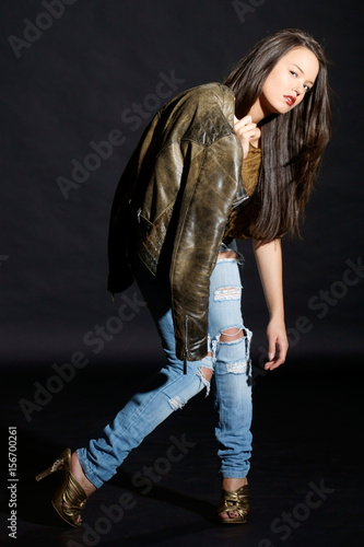 fashion style photo of young beautiful and sexy woman posing in casual clothes in studio