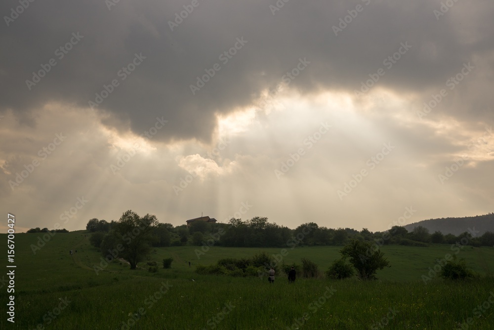 Sunset on meadow with hills and tree. Slovakia