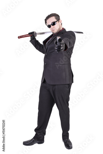 Handsome man holding katana sword foto de Stock | Adobe Stock