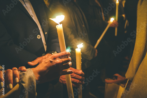 Woman holding a candle at night, during the Easter celebrations