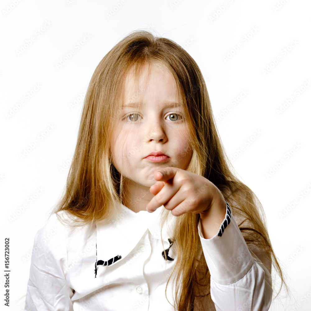Cute little girl posing for advertising, making signes by hands and face expressions Cute little girl posing for advertising, making signes by hands and face expressions