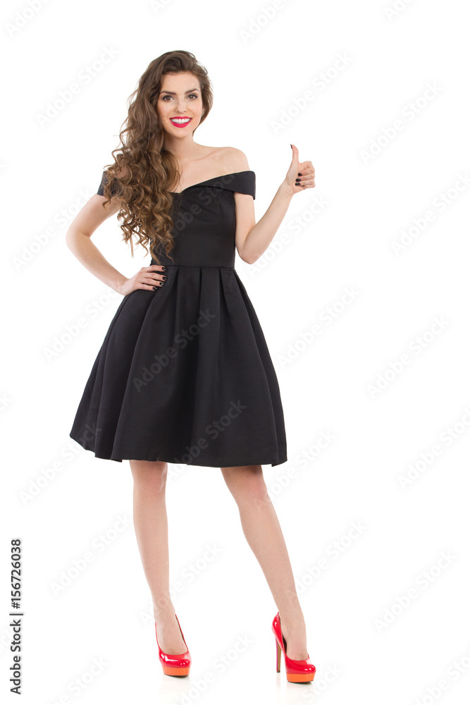 Elegant Young Woman In Black Dress Gives Like Elegant Young Woman In Black Dress Gives Like