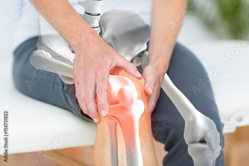 Man suffering with knee inflamation photo